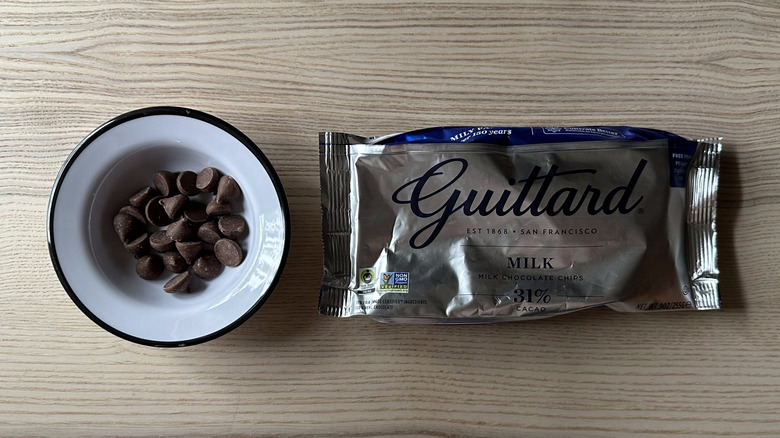 silver bag of Guittard chocolate with bowl of chips beside it