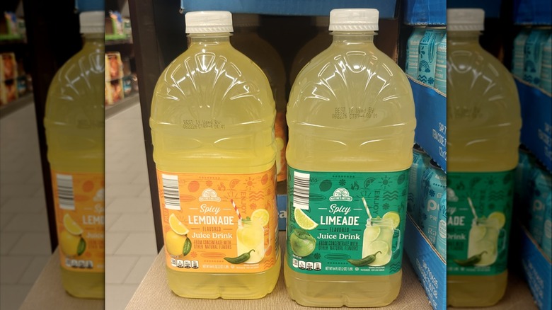A bottle of Nature's Nectar Spicy Lemonade and Nature's Nectar Spicy Limeade on a shelf at an Aldi store