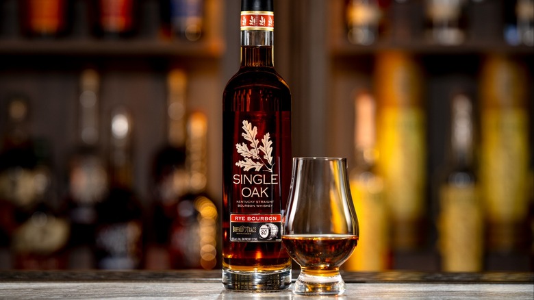 Bottle of Single Oak Barrel 80 bourbon with Glencairn glass