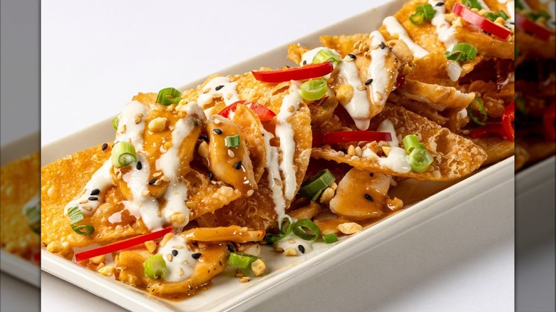 Asian Chicken Nachos from the Cheesecake Factory on white rectangular plate