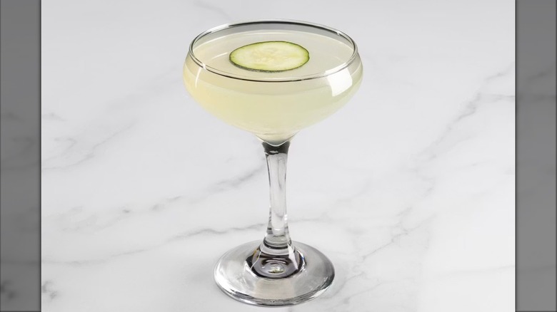 The Cheesecake Factory Fresh Cucumber Martini in martini glass sitting on white marbled surface