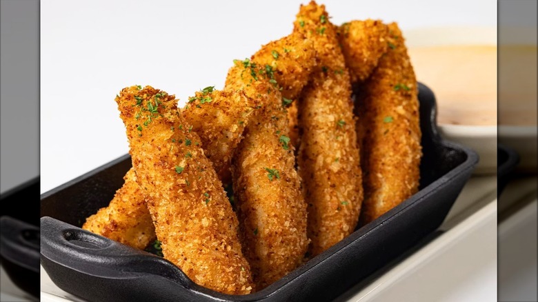 The Cheesecake Factory's Pickle Fries in black rectangular serving dish