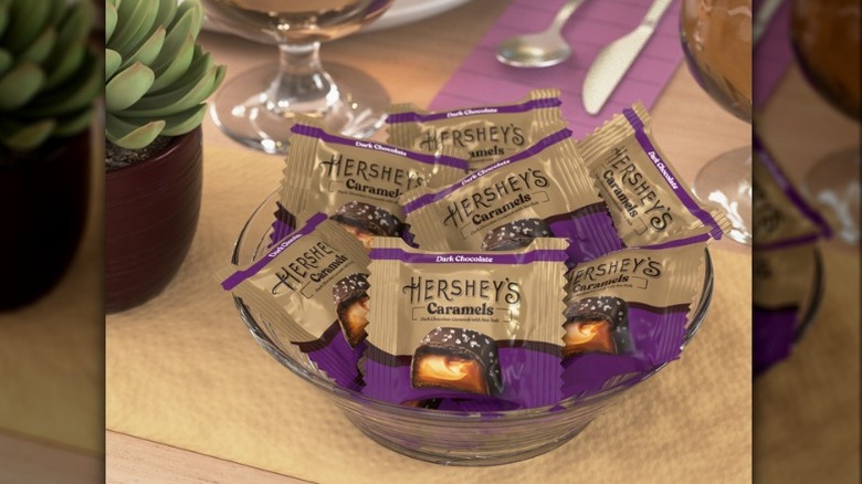 A bowl of individually-wrapped Hershey's dark chocolate caramels with sea salt