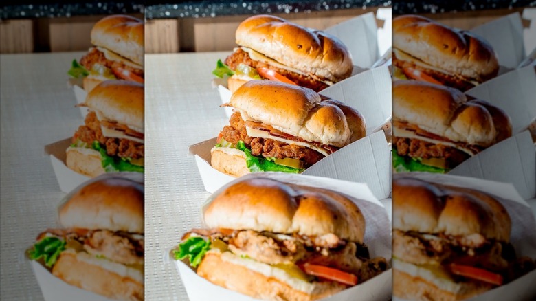 three Chick-fil-A Jalapeño Ranch Clubs in boxed containers on table