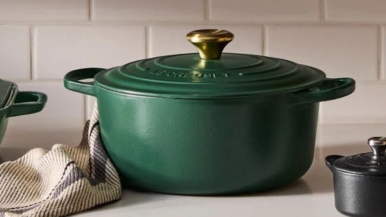 Le Creuset Dutch oven in color Forêt on white kitchen counter