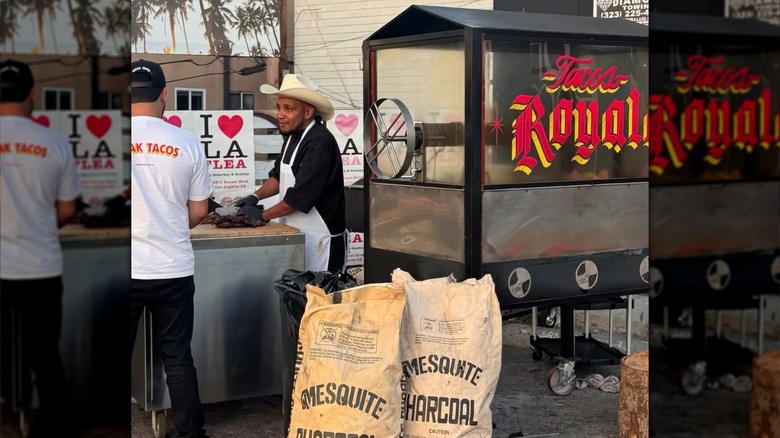 Bags of charcoal beside the Tacos Royale grill and prep space