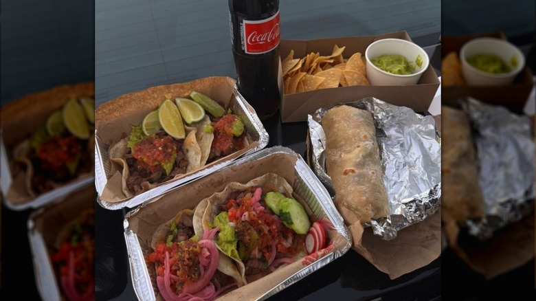 Several food options from Tacos Royale, including tacos, a burrito, and tortilla chips