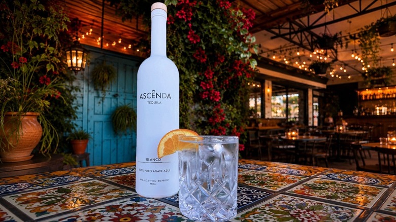 Bottle of Ascênda Tequila with cocktail