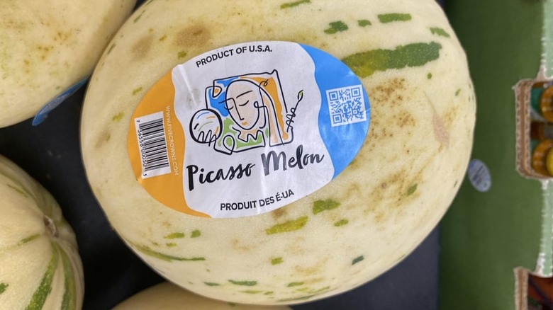 A box of Picasso melons on display in a store