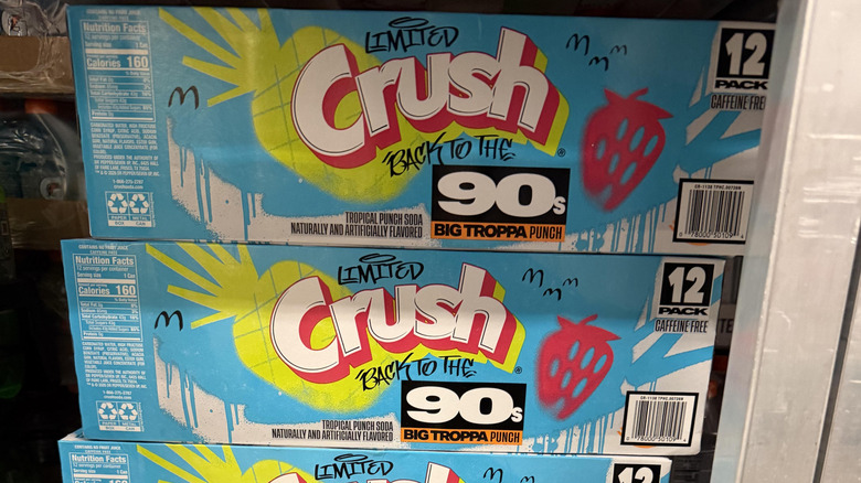 Stacked cases of Crush Back to the '90s Big Troppa Punch soda