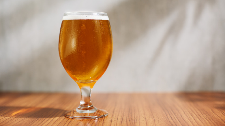A glass of golden beer