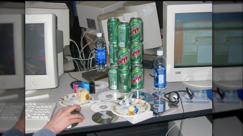 Stack of Mountain Dew cans with the 1998-2005 logo design