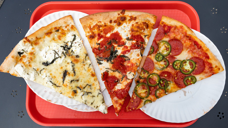 Three slices of pizza on a tray