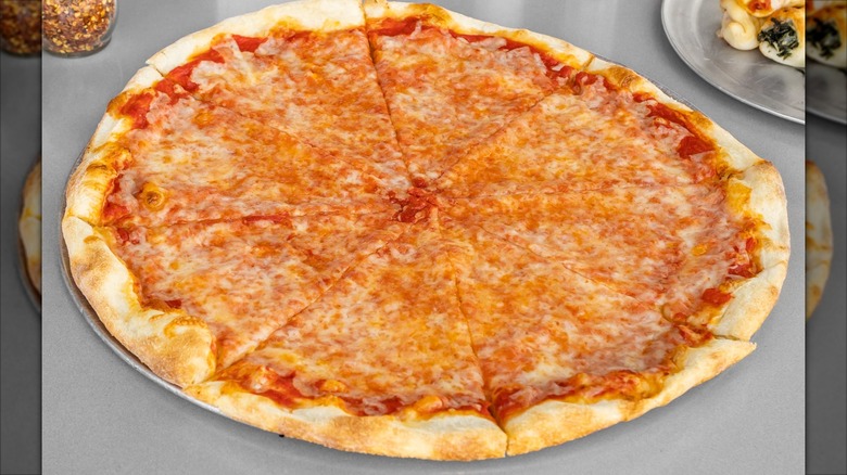 New York-style cheese pizza on tray