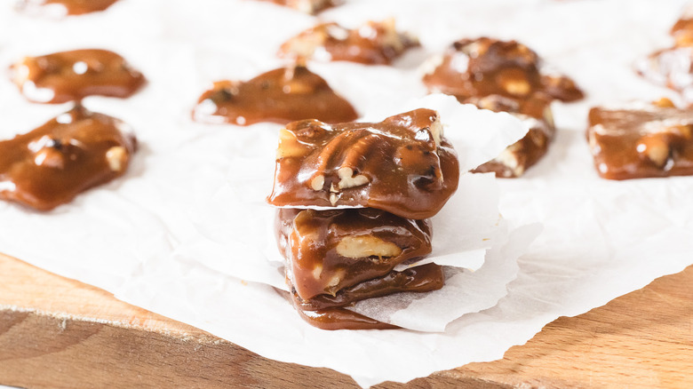 Stack of three pieces of candy over parchment paper