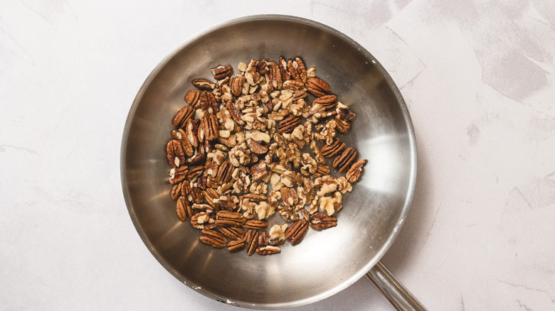 Pecans and walnuts in pan