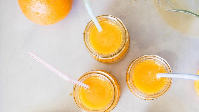 three glasses of orange juice