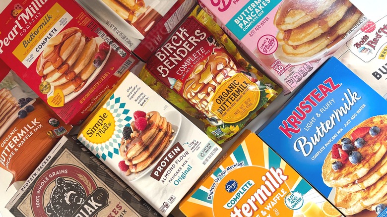 Array of boxed and bagged pancake mixes on table