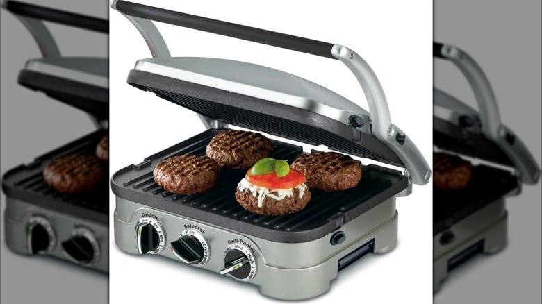 A Cuisinart Griddler cooking burgers