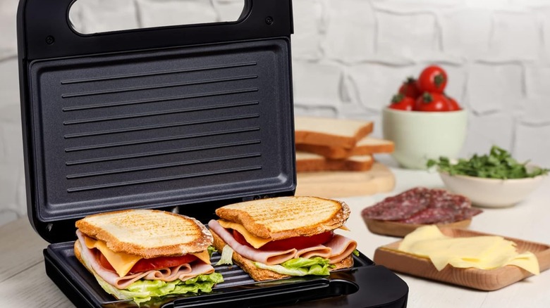 An OVENTE panini press with two paninis