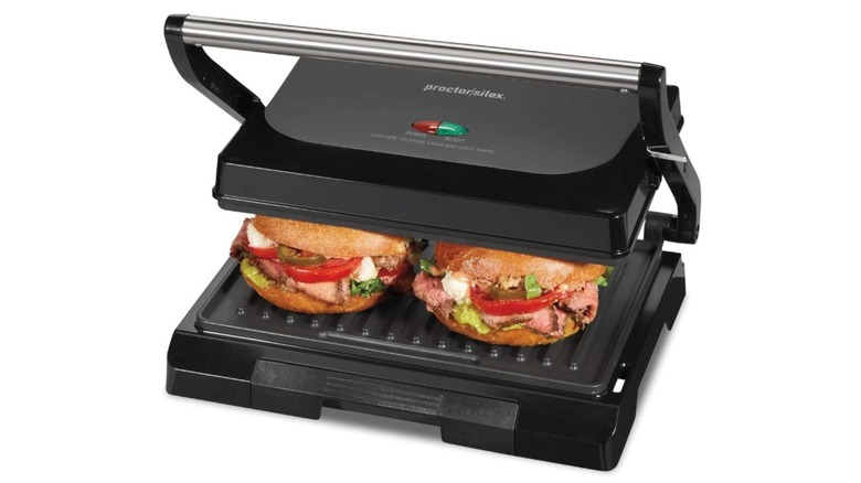 A Proctor Silex panini press cooking two paninis