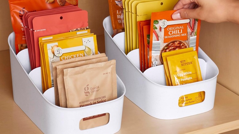 A person pulling a seasoning packet out of a YouCopia organizer