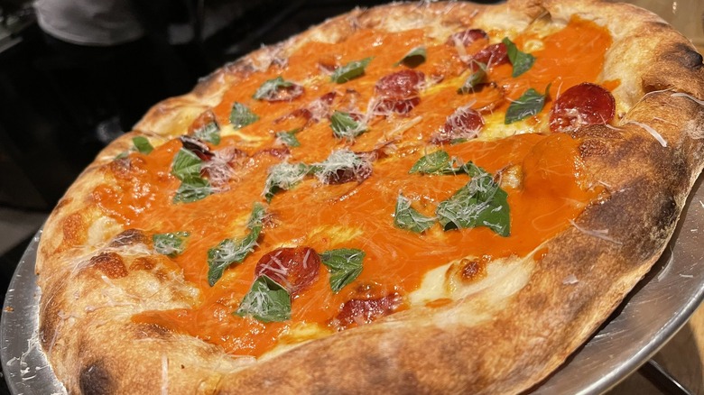Vodka sauce and pepperonis on pizza