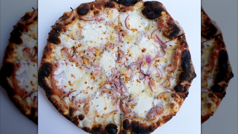 Pizza with red onion