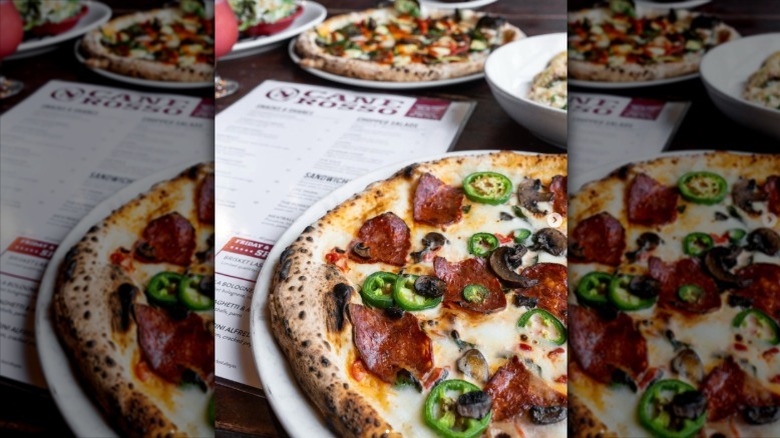 Cane Rosso pizza at table with meny