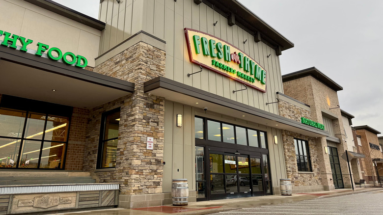 Fresh Thyme Market store front on cloudy day.