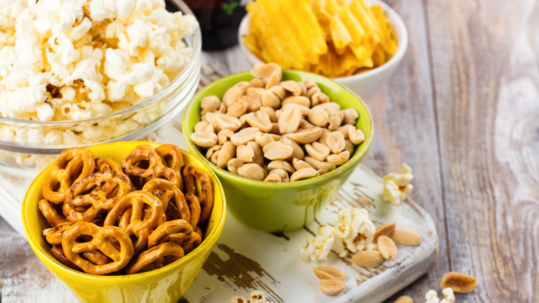 different bowls of dry snacks