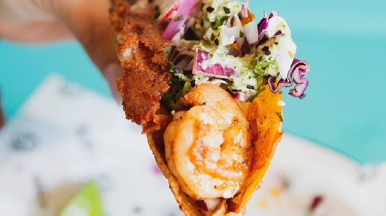 Shrimp taco with red onions