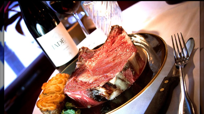 Prime with with wine bottle and glass on table