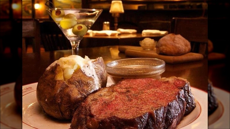 Prime rib and baked potato with martini