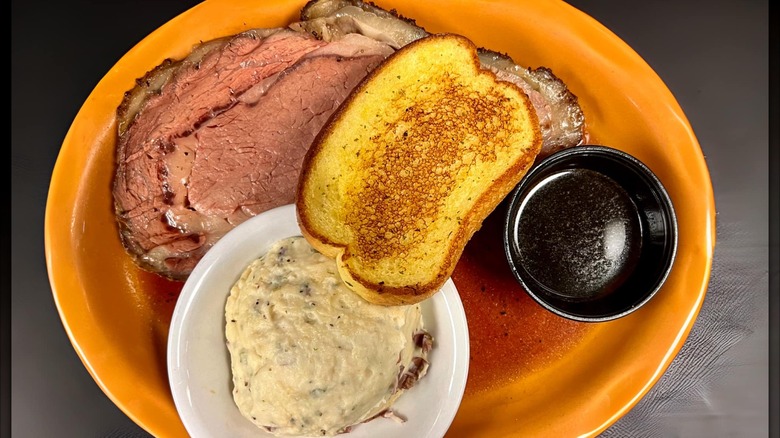 Prime rib with mashed potatoes, garlic toast, and au jus