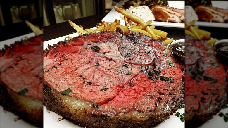 Slice of prime rib with fries