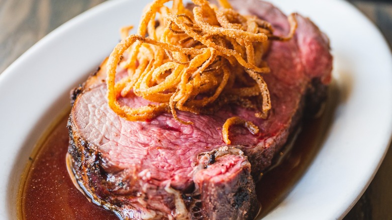 Prime rib and au jus with onion strings