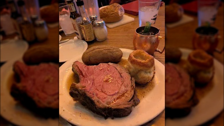 Prime rib with baked potato and Yorkshire puff