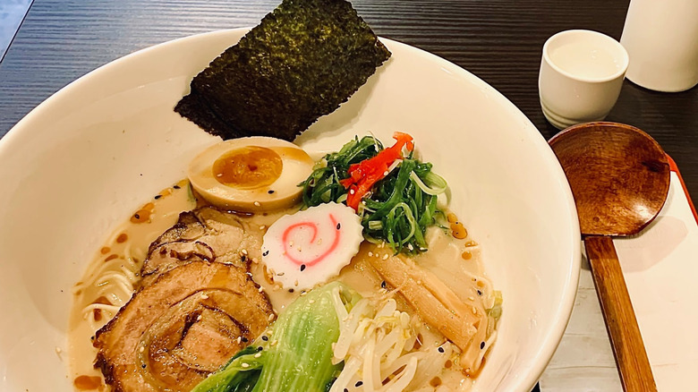 Tonkotsu ramen bowl with utensils