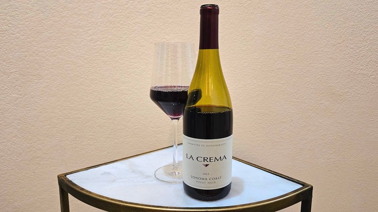 Bottle of La Crema Sonoma Coast Pinot Noir and glass