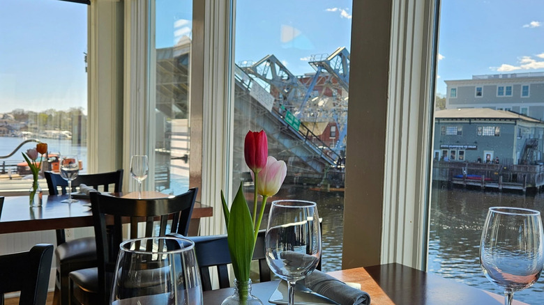 Tables at a restaurant looking out over the Mystic Drawbridge