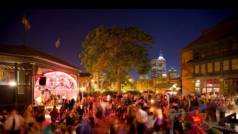 People dining and drinking in a rooftop beer garden