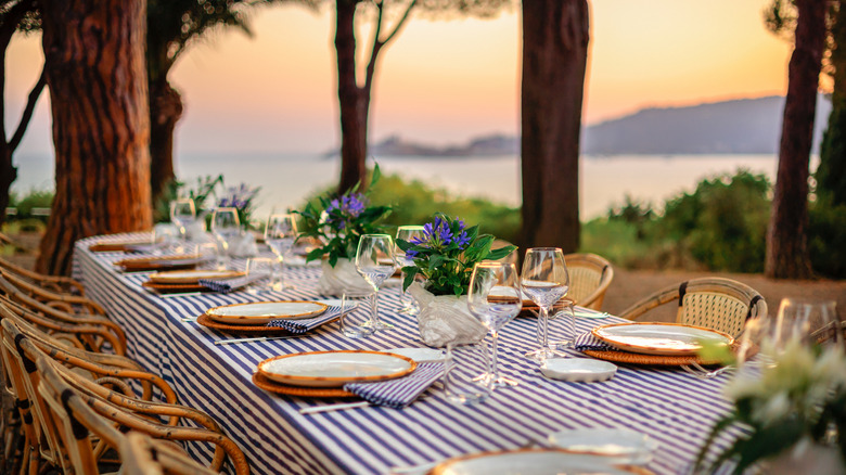 Set table with a sunset in the background