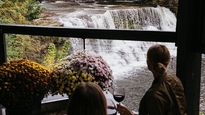Diners looking out over the falls at 17 River Grille