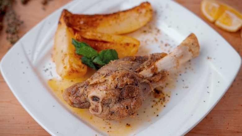 Marinated lamb shank on plate