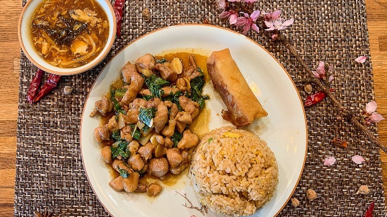 Plated chicken dish with rice