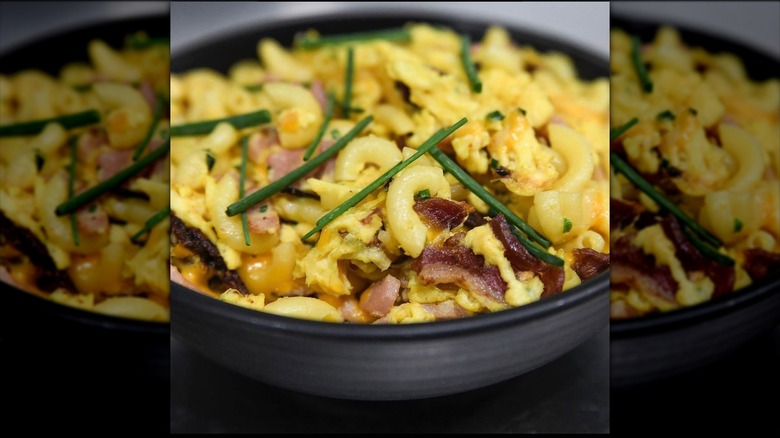 Breakfast pasta with scrambled eggs in bowl