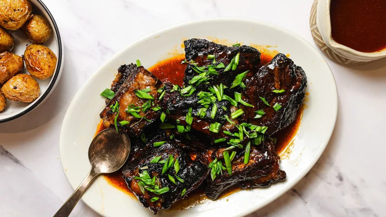3-Ingredient Crockpot Ribs with chopped green onions on top