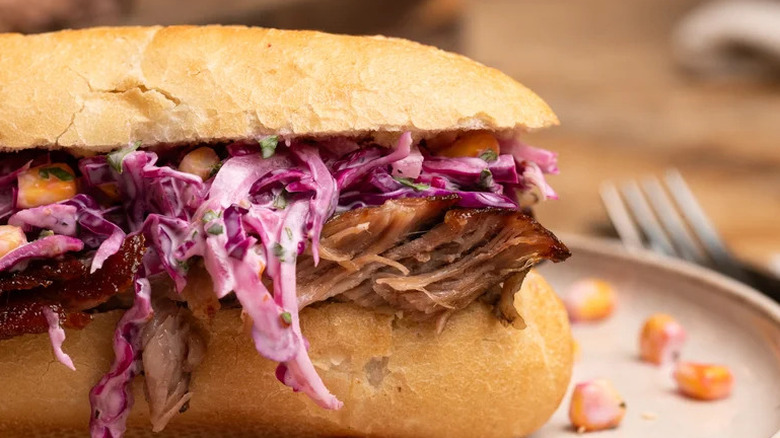 BBQ Pork Rib Sandwich with Corn Slaw on plate close up