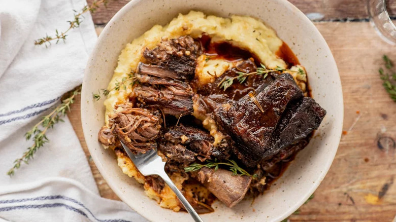 Red Wine-Braised Beef Short Ribs on white plate with mashed potatoes